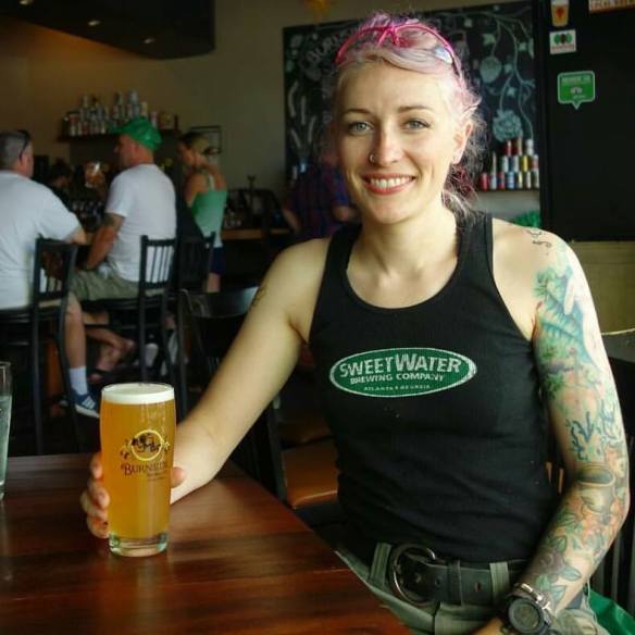 Natalie Baldwin is the brewer at Burnside Brewing in Portland seen here smiling over a pint